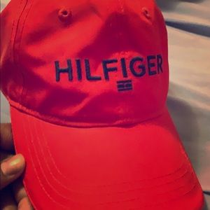 Red Tommy Hilfiger hat with navy blue letters